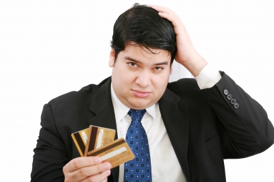 man confused with credit cards.jpg man confused with credit cards.jpg